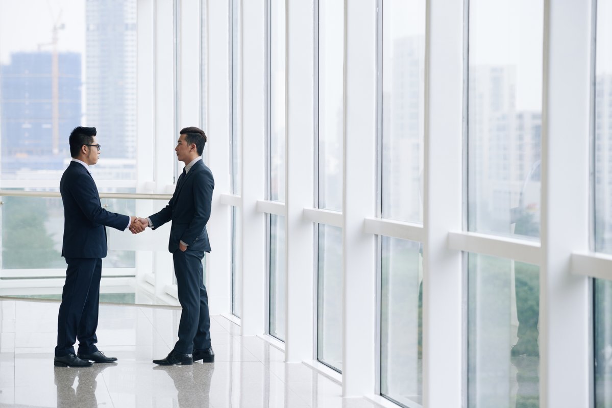 Business partnership handshake